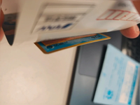 Close-up of the partially peeled backing and partially visible Marill card.