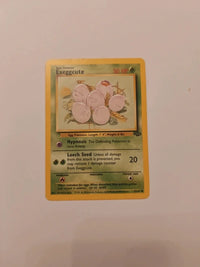 Exeggcute 52/64 | Moderately to heavily played actual card photograph