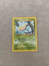 Weedle 69/102 | Moderately to heavily played actual card photograph