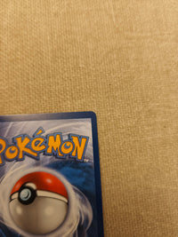 Yanmega ex 003/182 English, actual card back upper-right detail