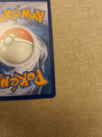Yanmega ex 003/182 English, actual card back lower-right detail