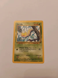 Weedle 69/102 | Moderately to heavily played actual card photograph